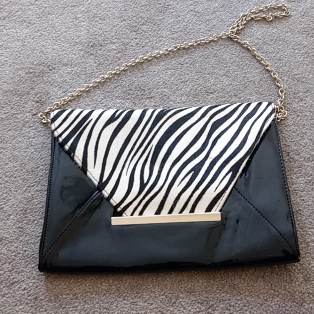 Zebra and black clutch.